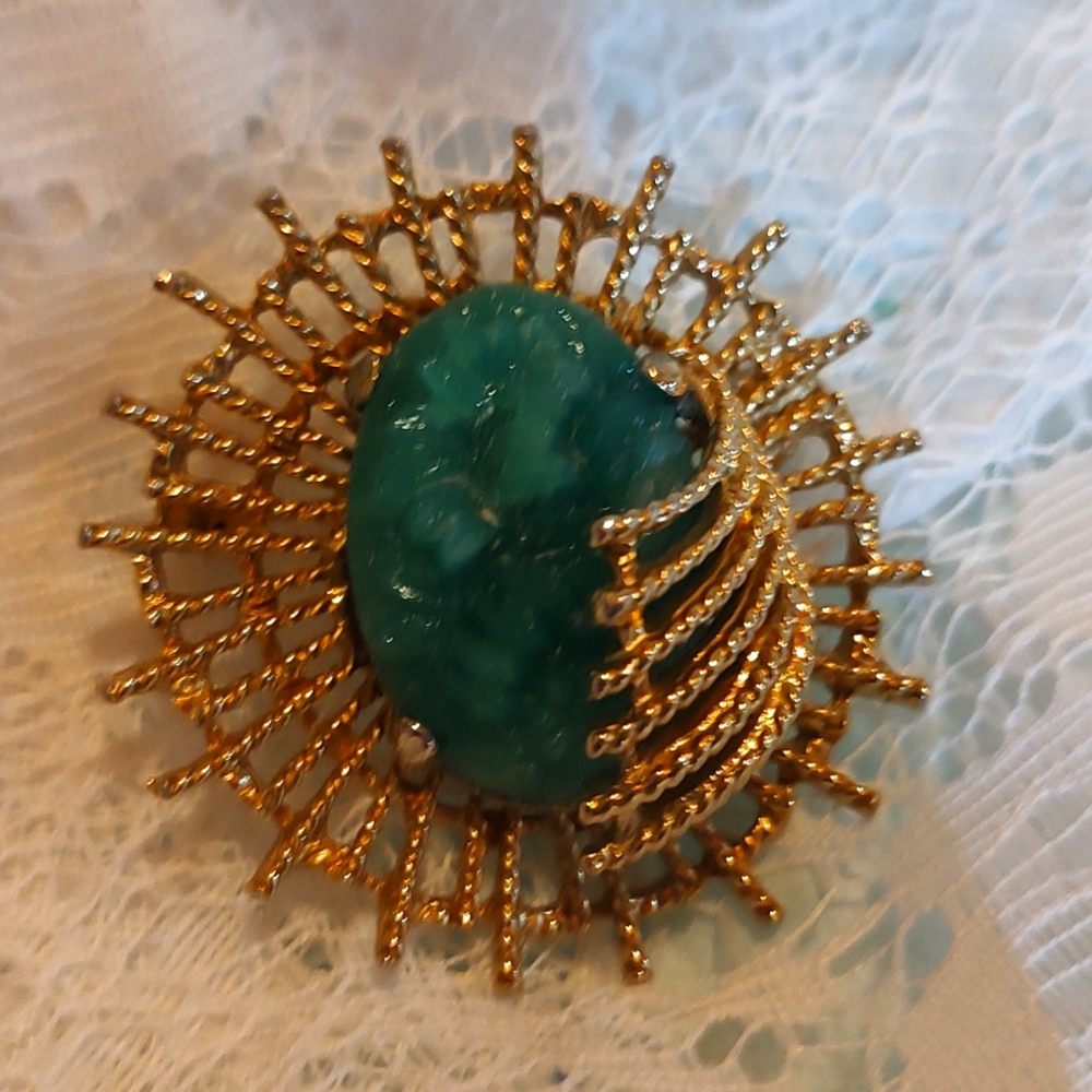 Goldette signed Star Burst Broach with Green stone.